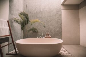 A photograph of a freestanding tub in a modern bathroom.